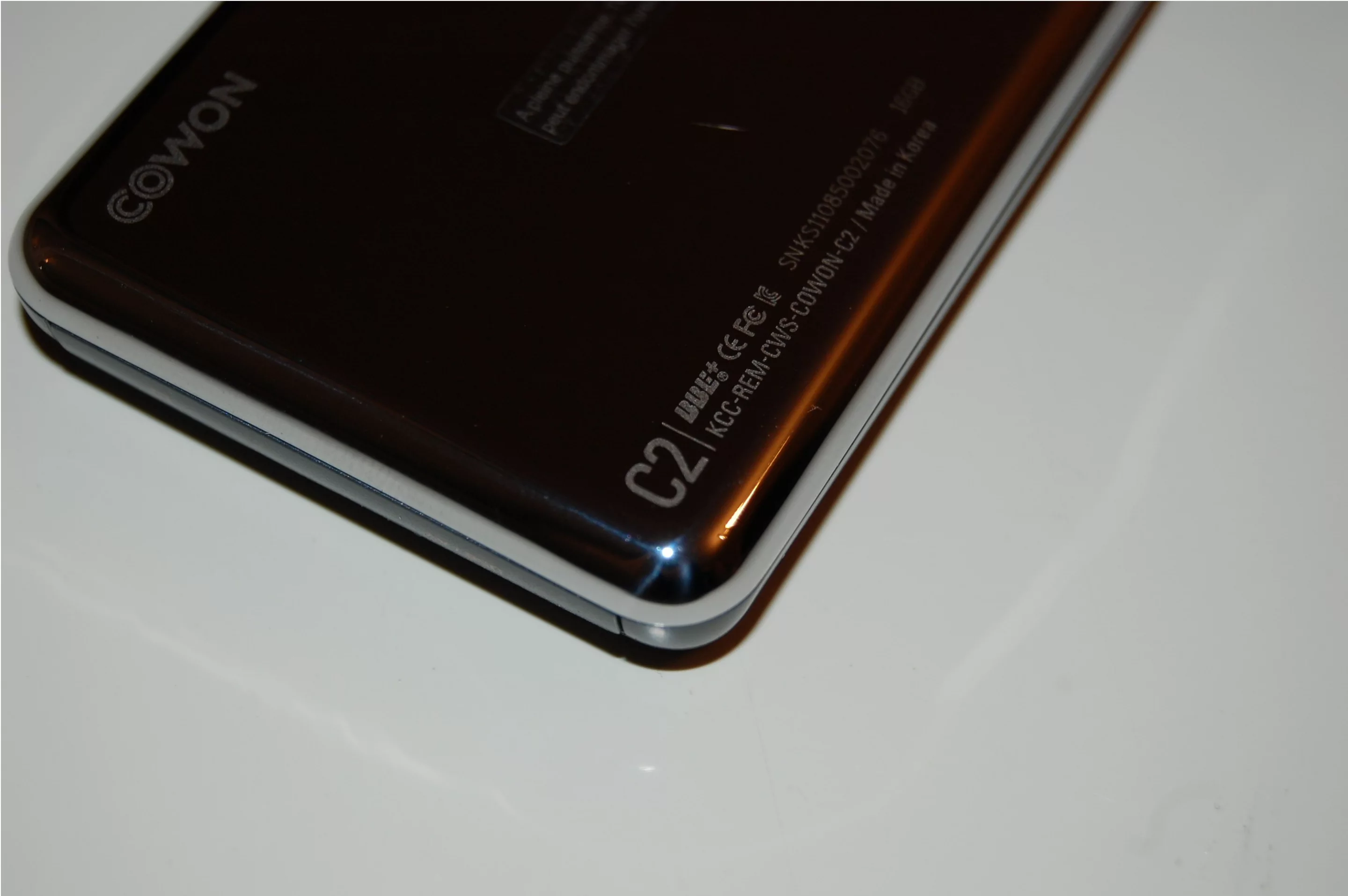 There's a shiny metal case on the back with engraved branding and serial number (a classy touch)