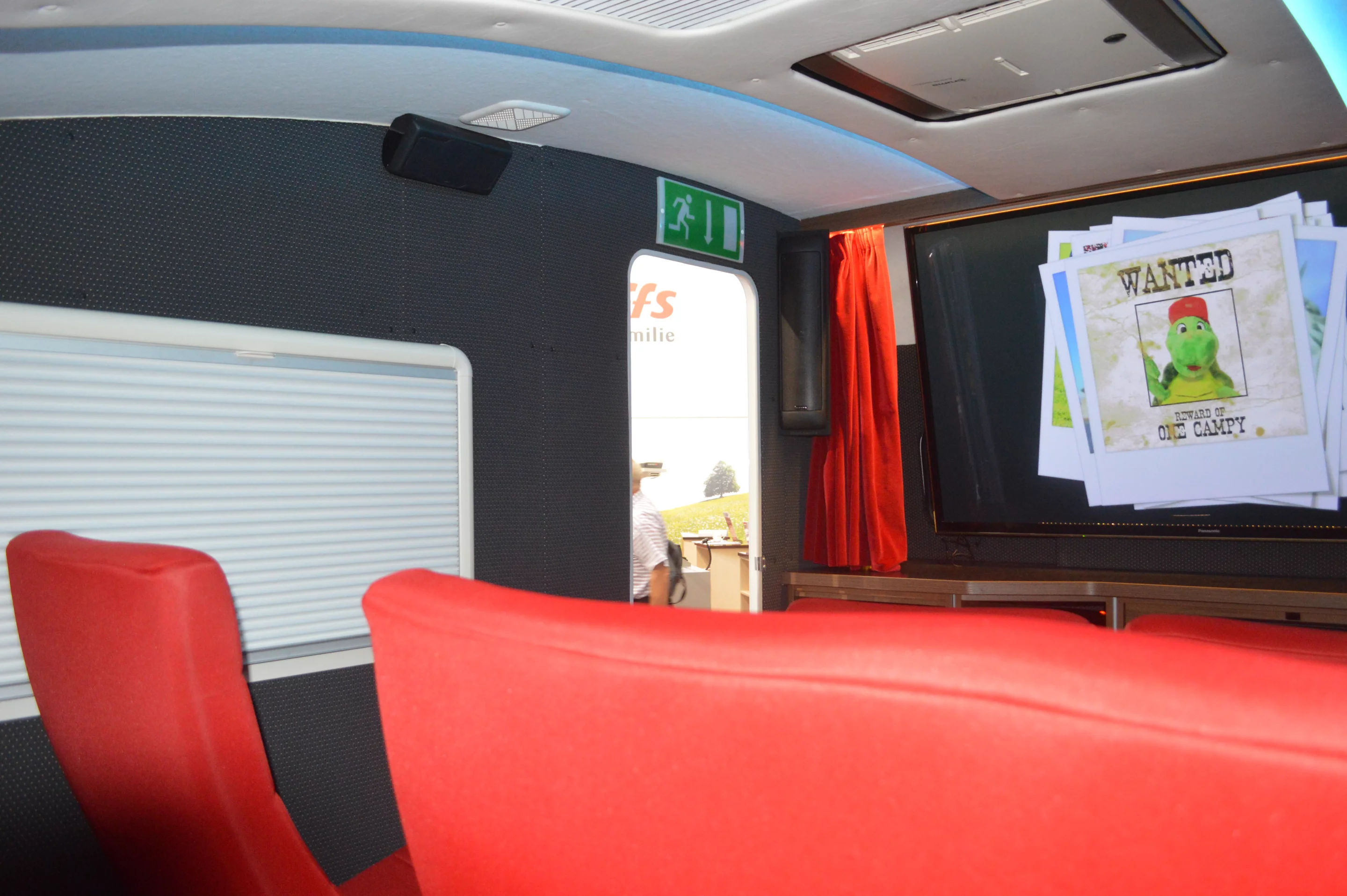 A set of surround sound speakers line the front, sides and back of the camper