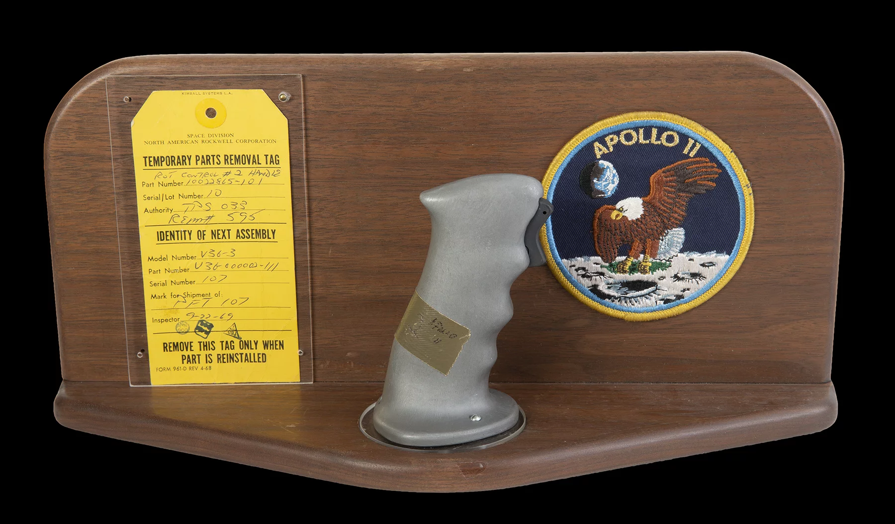 $370,000 | Neil Armstrong's Apollo 11 Control Joystick | Julien's Auctions | Estimate: $100,000 - $200,000 | 18 July 2020 | The original rotational attitude control stick (aka rotation hand controller) from the Apollo 11 command module Columbia in 1969. This control handle, located near the right hand of astronaut and mission commander Neil Armstrong (positioned in the left couch of the command module) allowed navigation of the spacecraft's attitude using roll, pitch, and yaw adjustments. The control stick is fitted with a trigger switch for activating the headset microphone. Included is a wooden display mount with an Apollo 11 mission patch and the original parts removal tag (dated September 22, 1969) with matching serial numbers and official NASA stamps. Part number 10022865-101. Serial number 10. NOTE: The provenance of this item has been corroborated by an official NASA audit report published by the Office of Inspector General in 2018.