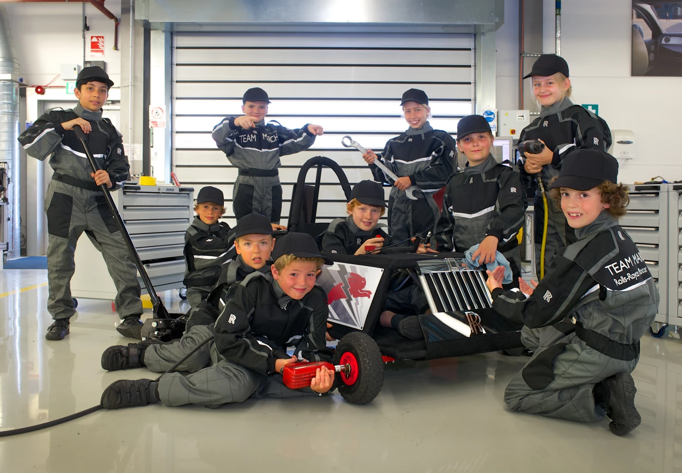 The children pose in their RR overalls