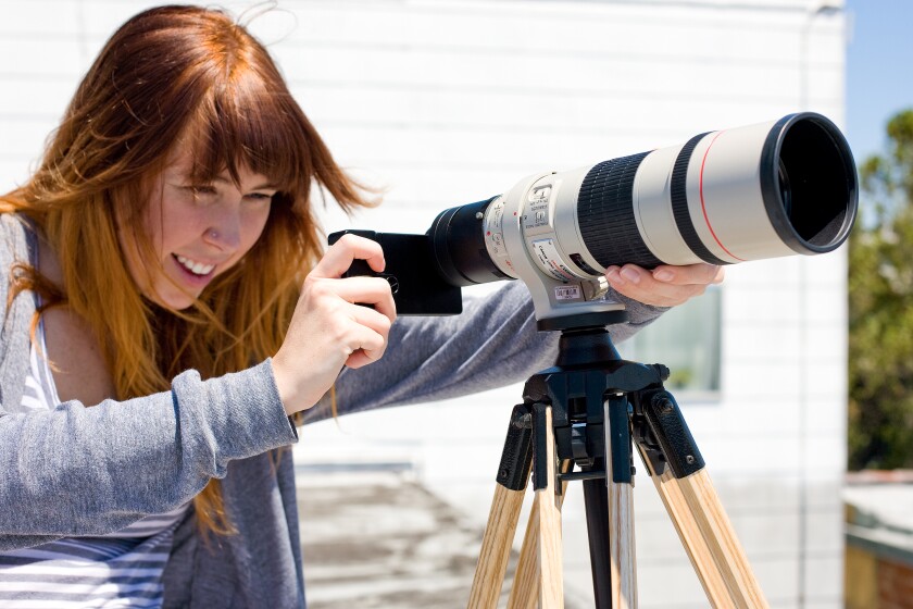 The iPhone SLR mount being used with a monster Canon lens (Photo: Photojojo)