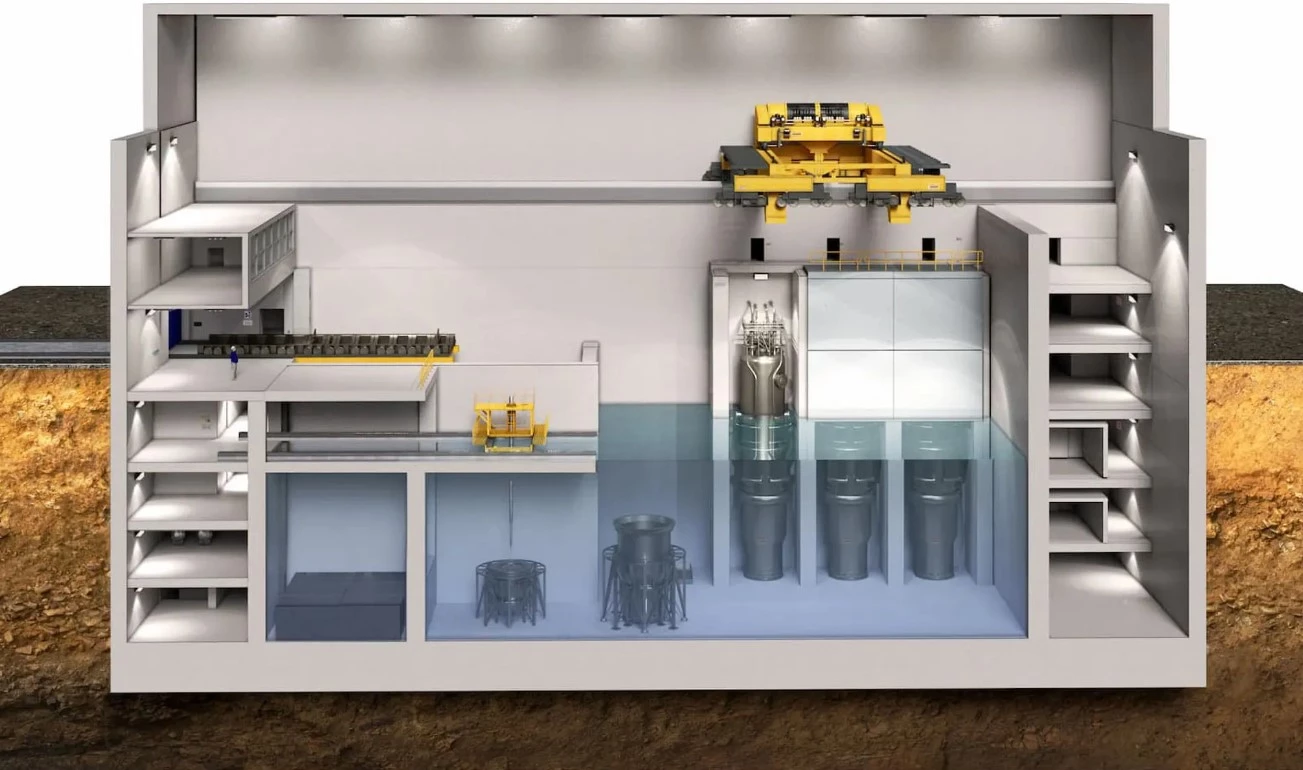 The NuScale SMR design places between 4-12 small modular reactor units together in a water bath, each mass-produced at low cost in a factory