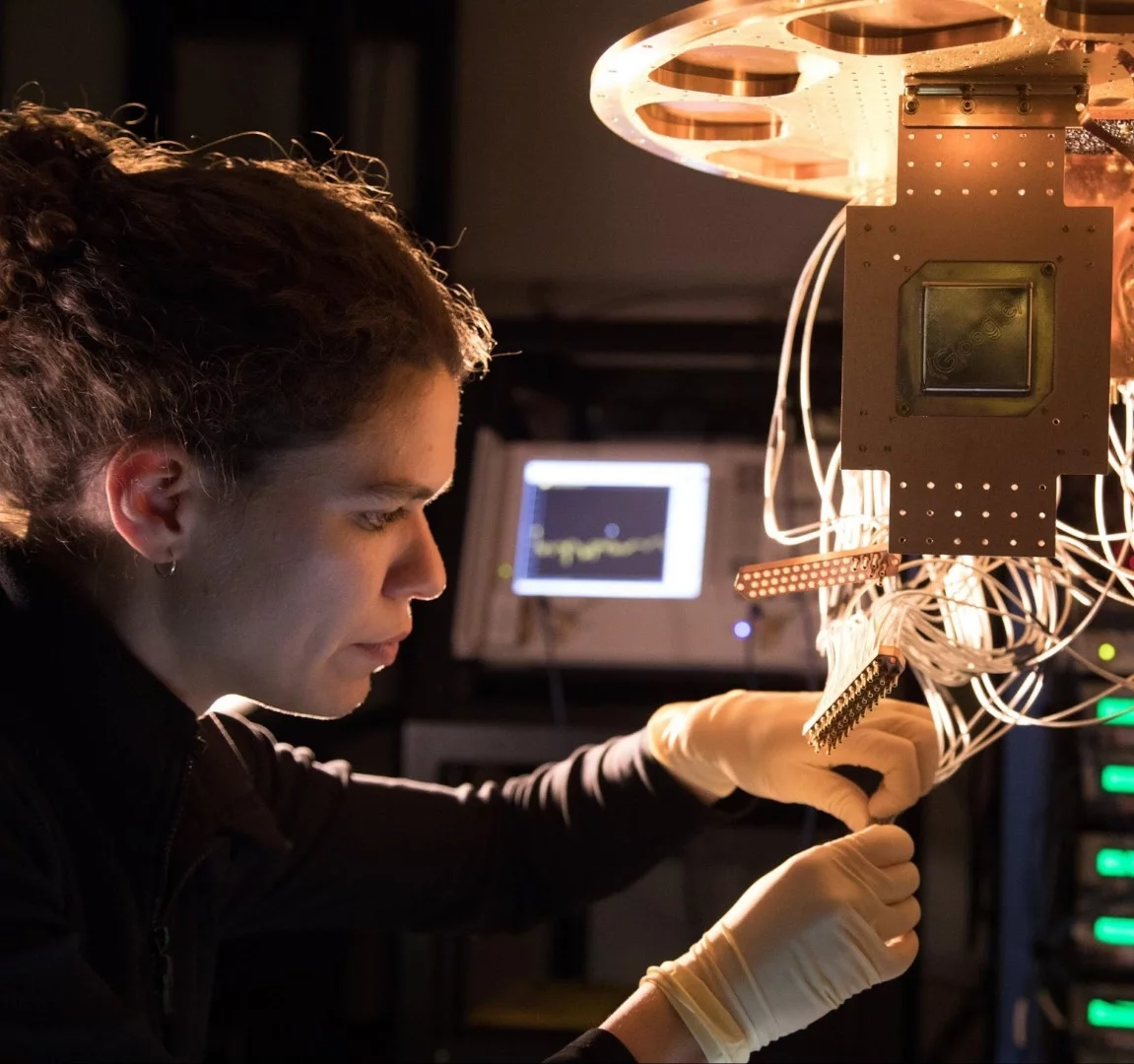 Research Scientist Marissa Giustina installs a Bristlecone chip