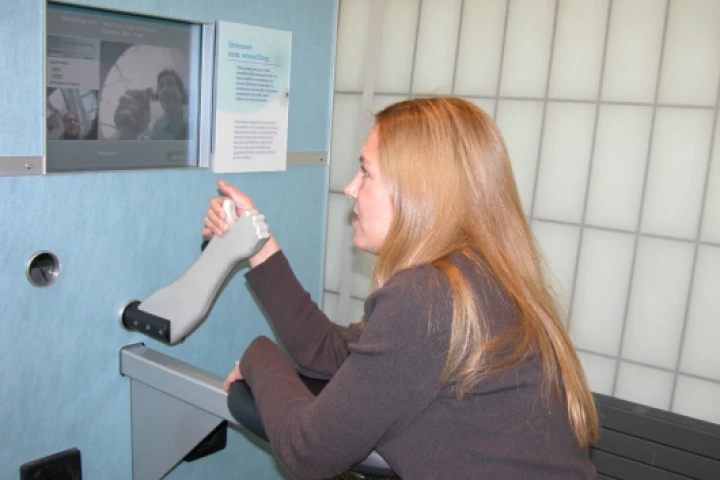 Wendy J. Brez tests out the machine at the New York Hall of Science in Queens, NY.
