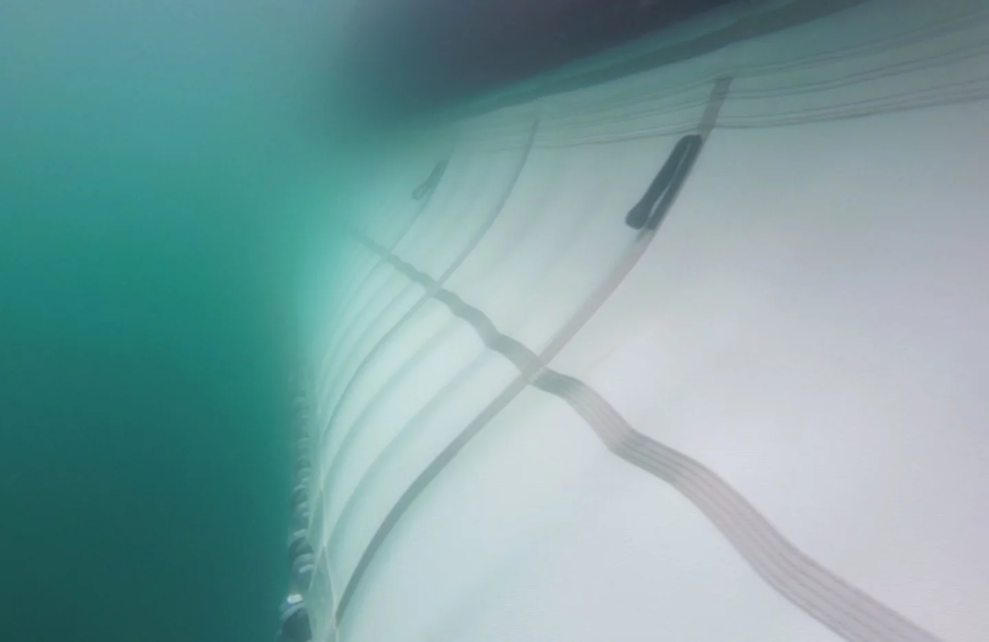 The hanging screen of The Ocean Cleanup Project's trash-collection barrier