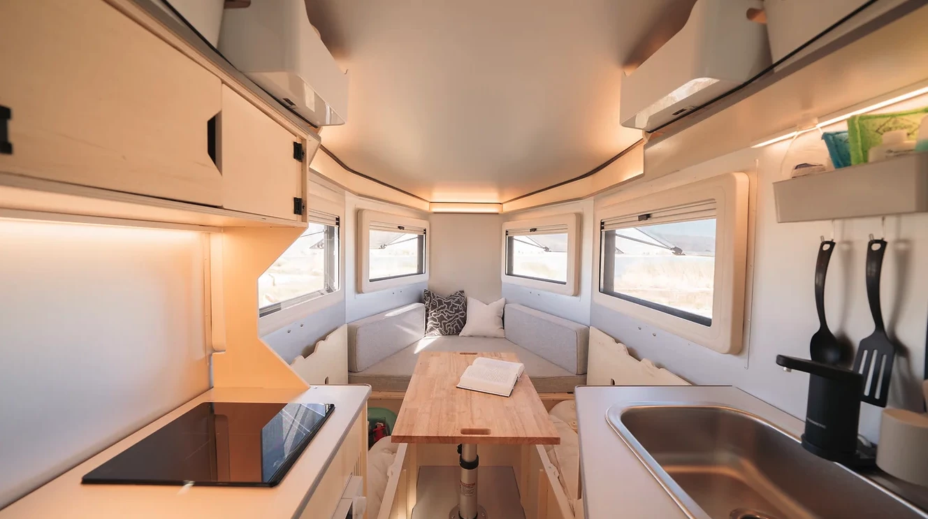Looking toward the queen bed/dinette with under-bench storage