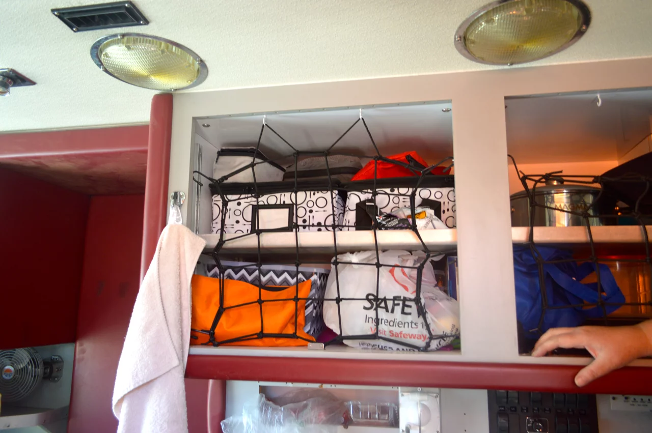 The owners said that the cabinet doors have a tendency to rattle and bust open, so they replaced them with webbing