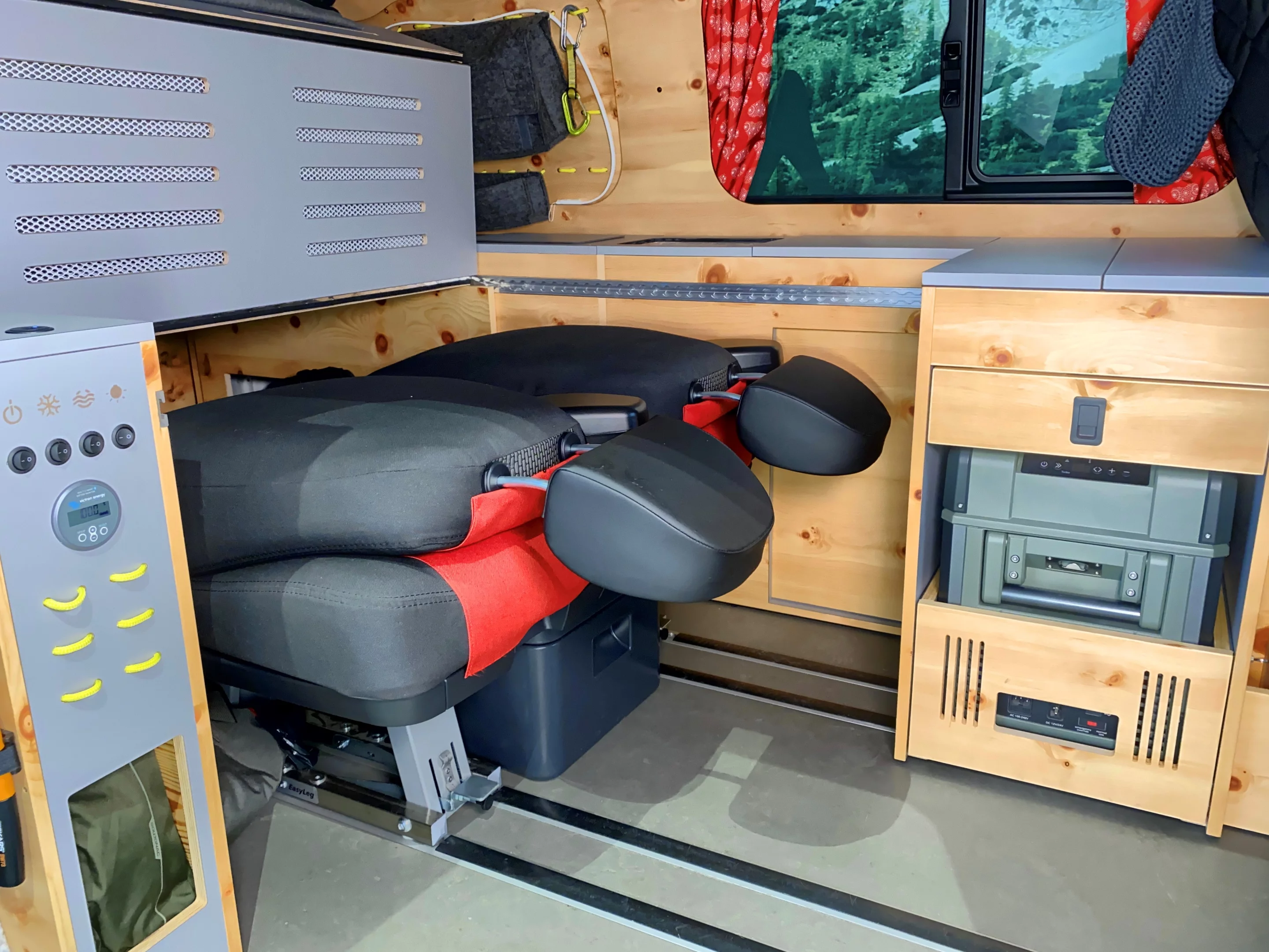 The bed folds over top the rear seats and also works with the rear seats removed
