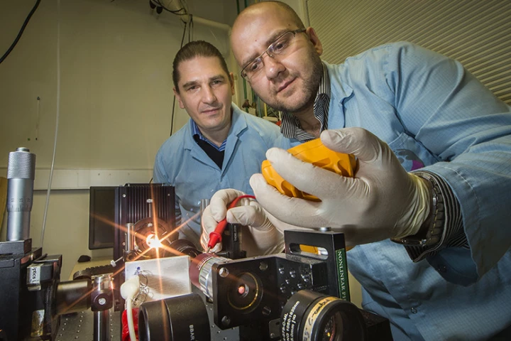 Researchers Andrey Miroshnichenko (left) and Mohsen Rahmani (right) demonstrate the new nanomaterial