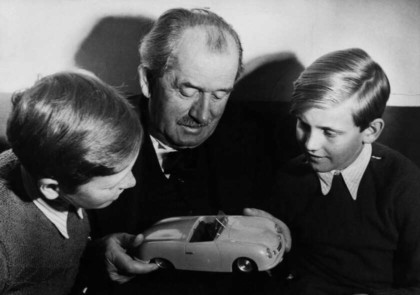 Porsche founder Professor Ferdinand Porsche with a model of the Porsche 356 and his grandchildren Ferdinand Piëch (right) and Ferdinand Alexander Porsche. Piëch was CEO of Volkswagen until 2002. Ferdinand Alexander Porsche (left) passed away yesterday.