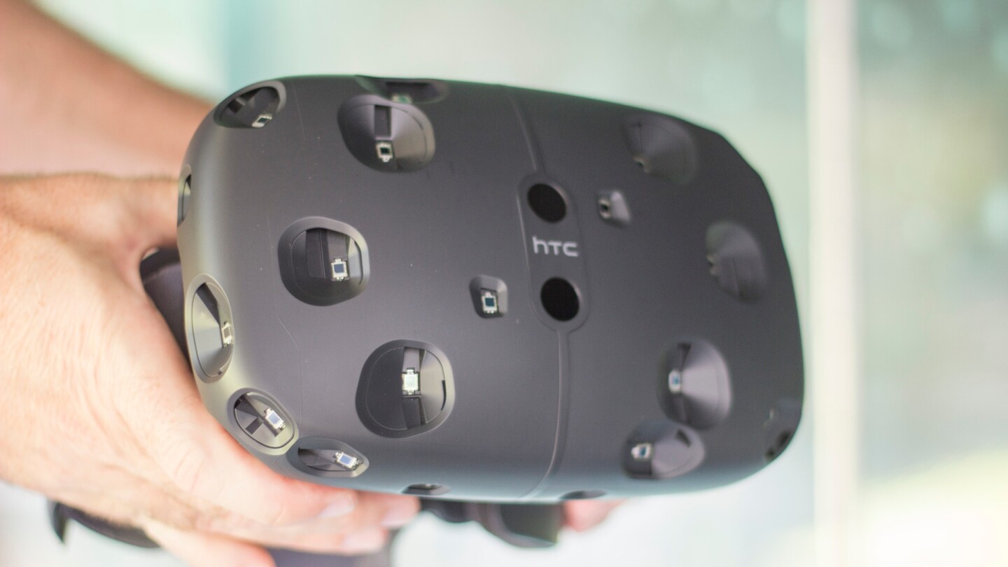 The HTC Vive has sensors that two base stations track, to let you roam freely