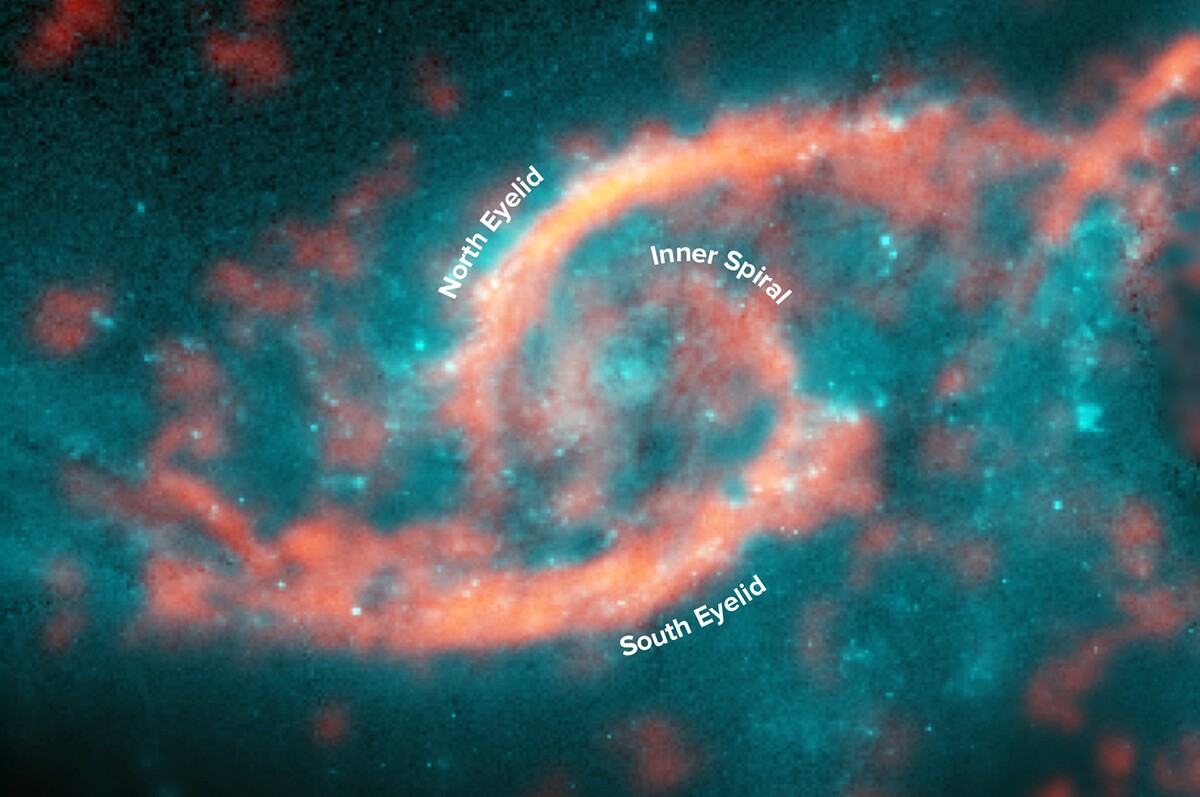Annotated ALMA image of carbon monoxide disposition (displayed in orange) accross IC 2163 overlayed on a visible light image captured by the Hubble Space Telescope