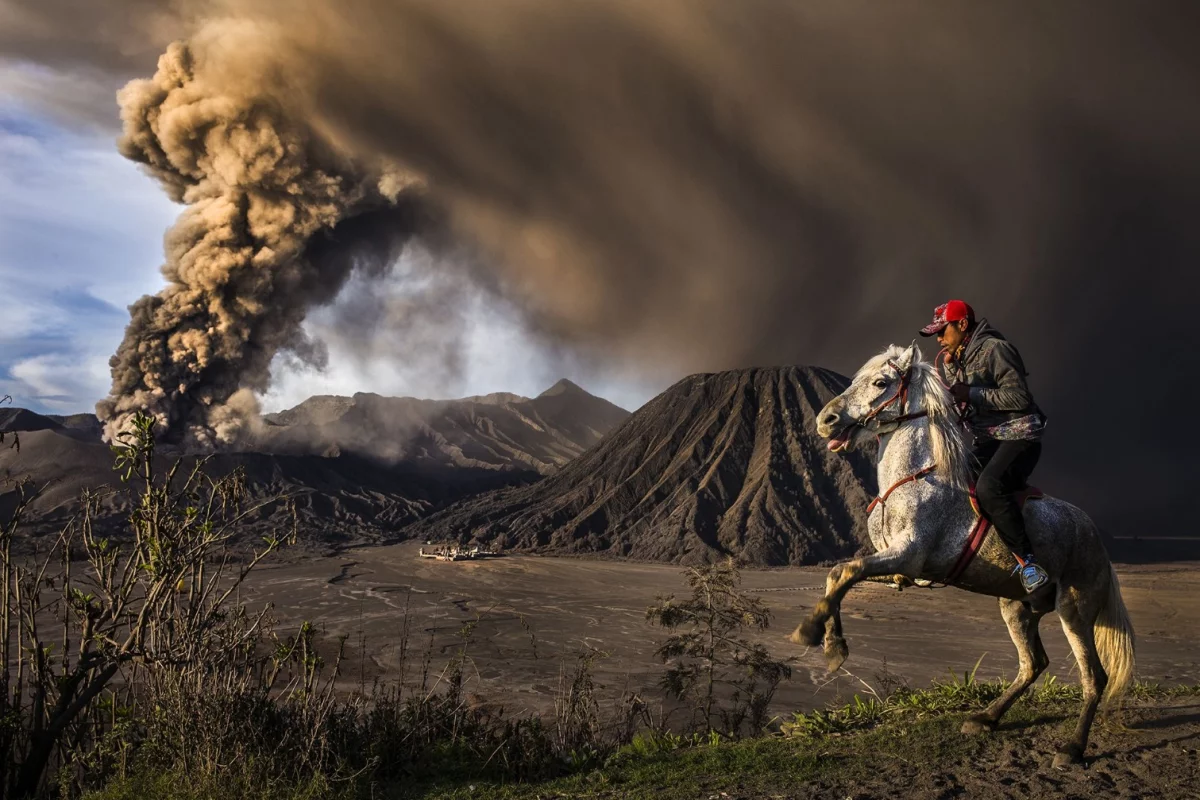 Second place in Journeys and Adventures category of the 2018 Siena International Photo Awards. The explosive eruption and loud rumbling of the Mt. Bromo volcano scared the horse causing it to rear up onto its hind legs