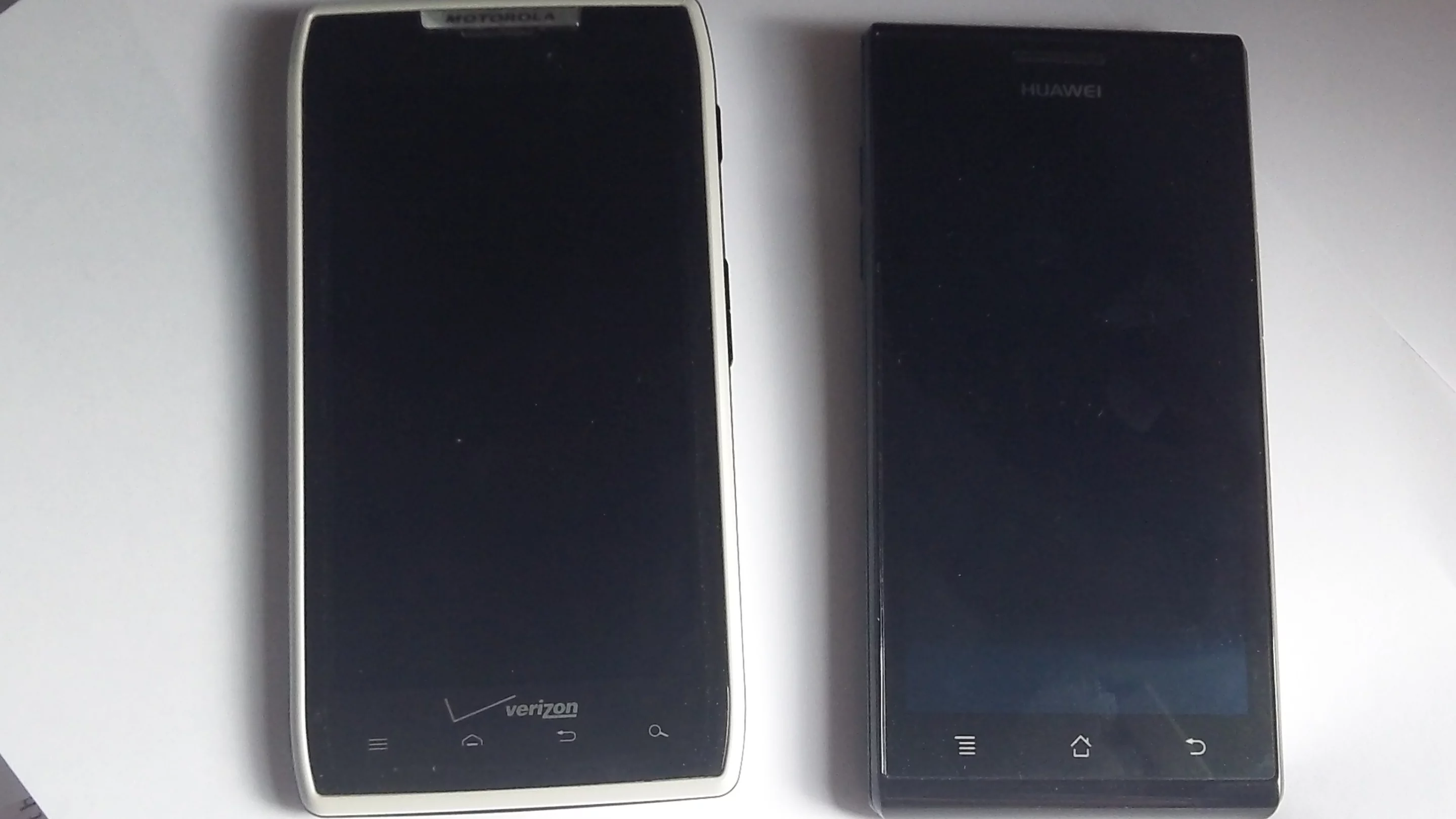 The Ascend P1 (right) is nearly the same size as a Droid Razr