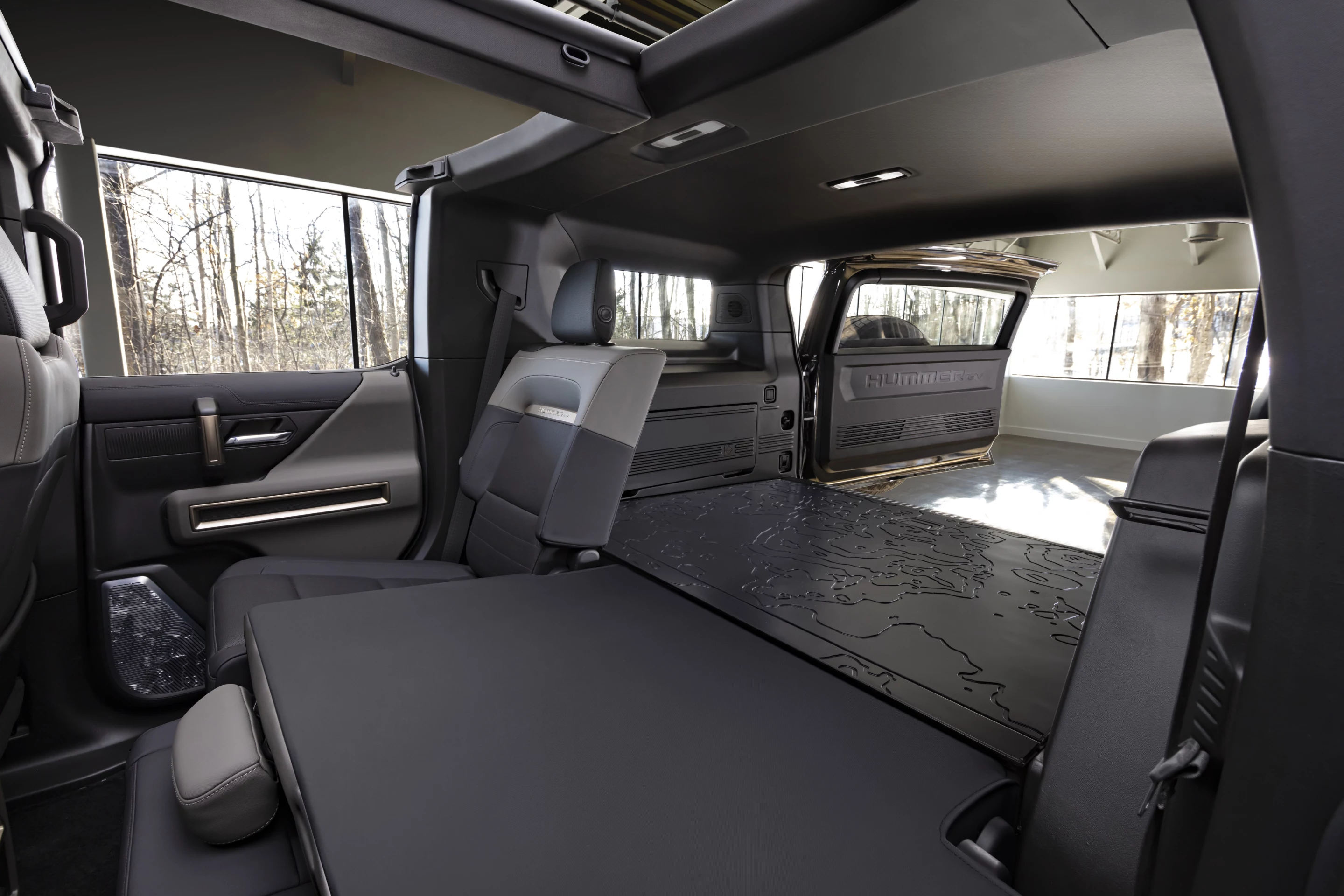 Fold-flat seating in the GMC Hummer EV SUV and a wide rear opening allow for maximum cargo