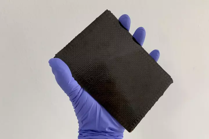 A sample of the tannic acid-augmented carbon fiber, which chars on the outside to keep from burning outright