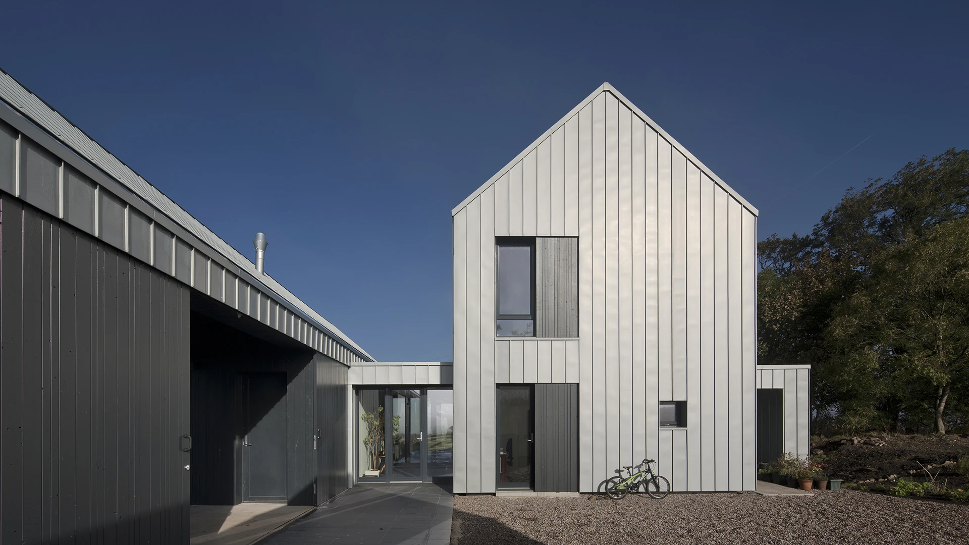 Newhouse of Auchengee's zinc external cladding reflects the light