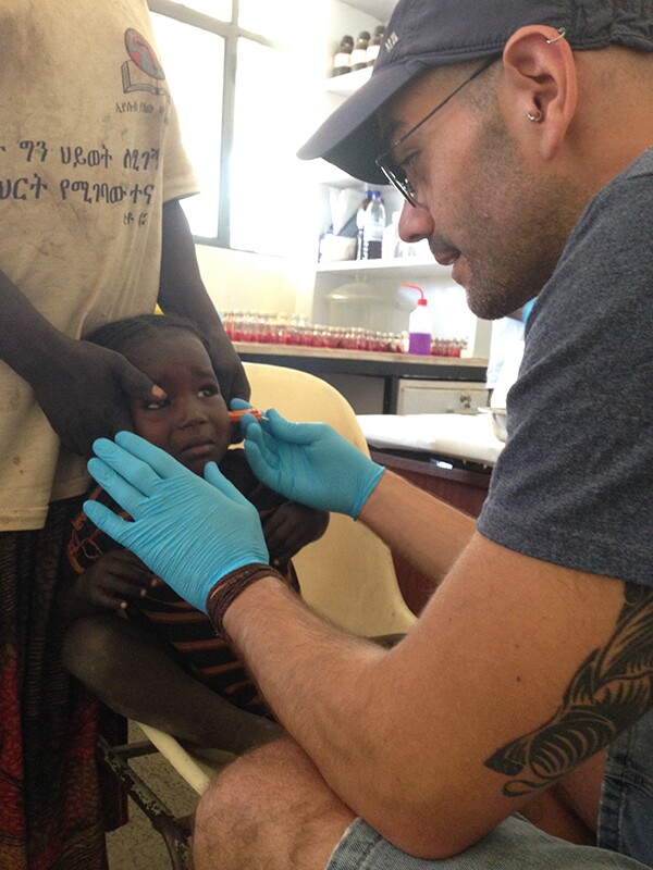 A researcher uses the microbiopsy device on a field test in Africa