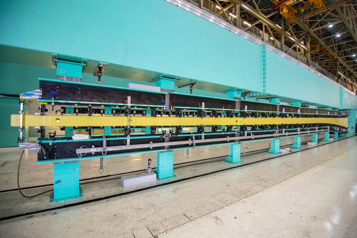 An 82.4-foot long 767 wing spar is loaded into a tool in Boeing’s Everett, WA, factory, kicking off assembly of the first KC-46A tanker for Japan
