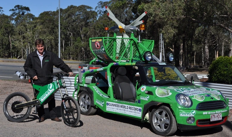 Allan Lear with the modified Stealth Bomber and waste-food-fueled Mini Moke