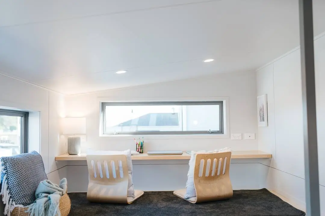 The Larissa and Tyler Tiny House has an office space in the loft