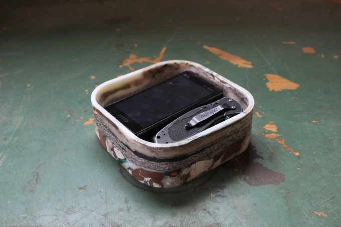 This medium-sized desk organizer is large enough to fit a smartphone and a small folding knife