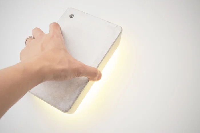 Brick Lamp is designed to be tactile, as lifting it acts as the On/Off switch