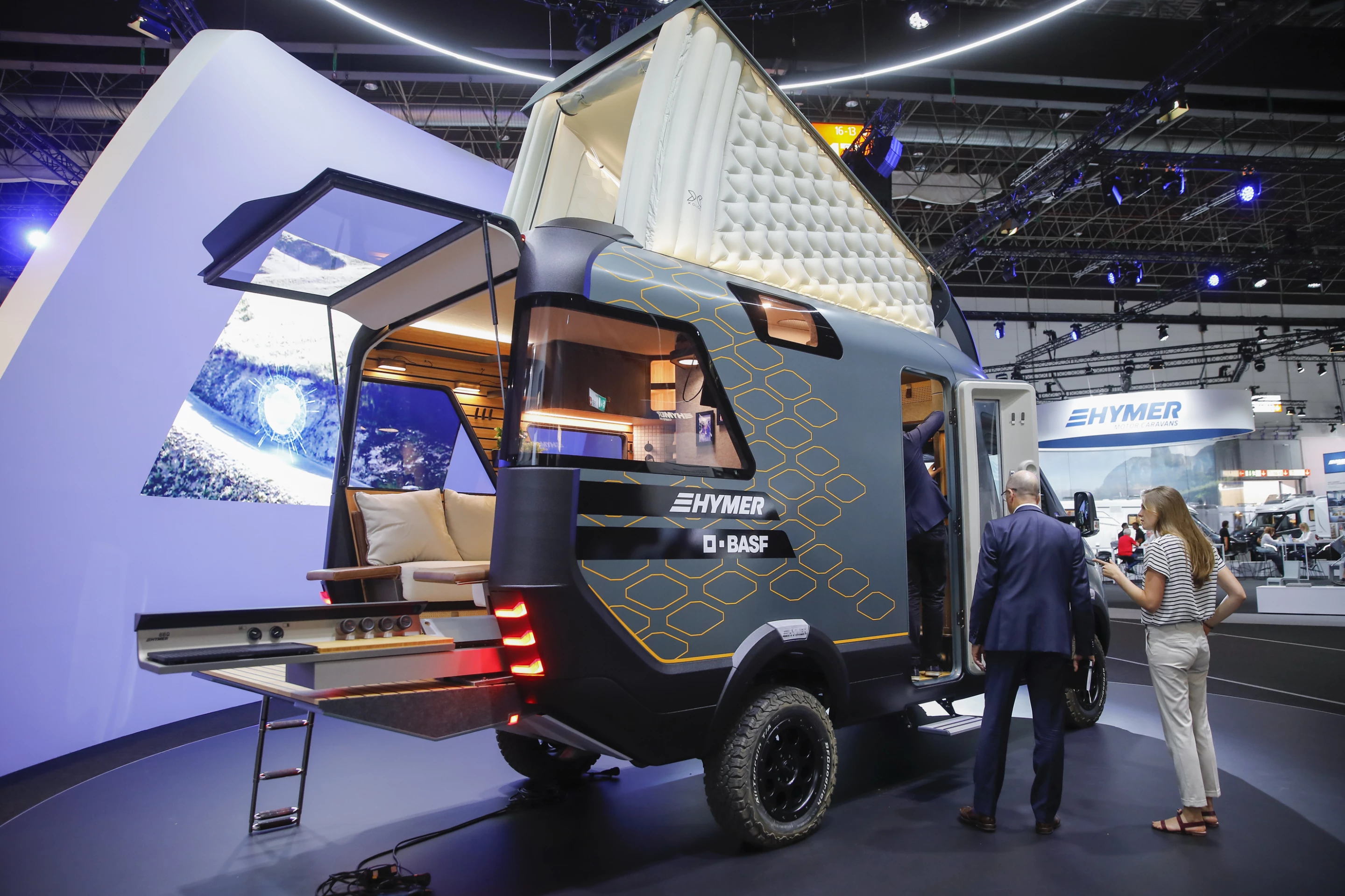 An electric grill slides out the back for outdoor cooking, a feature every camper van could use