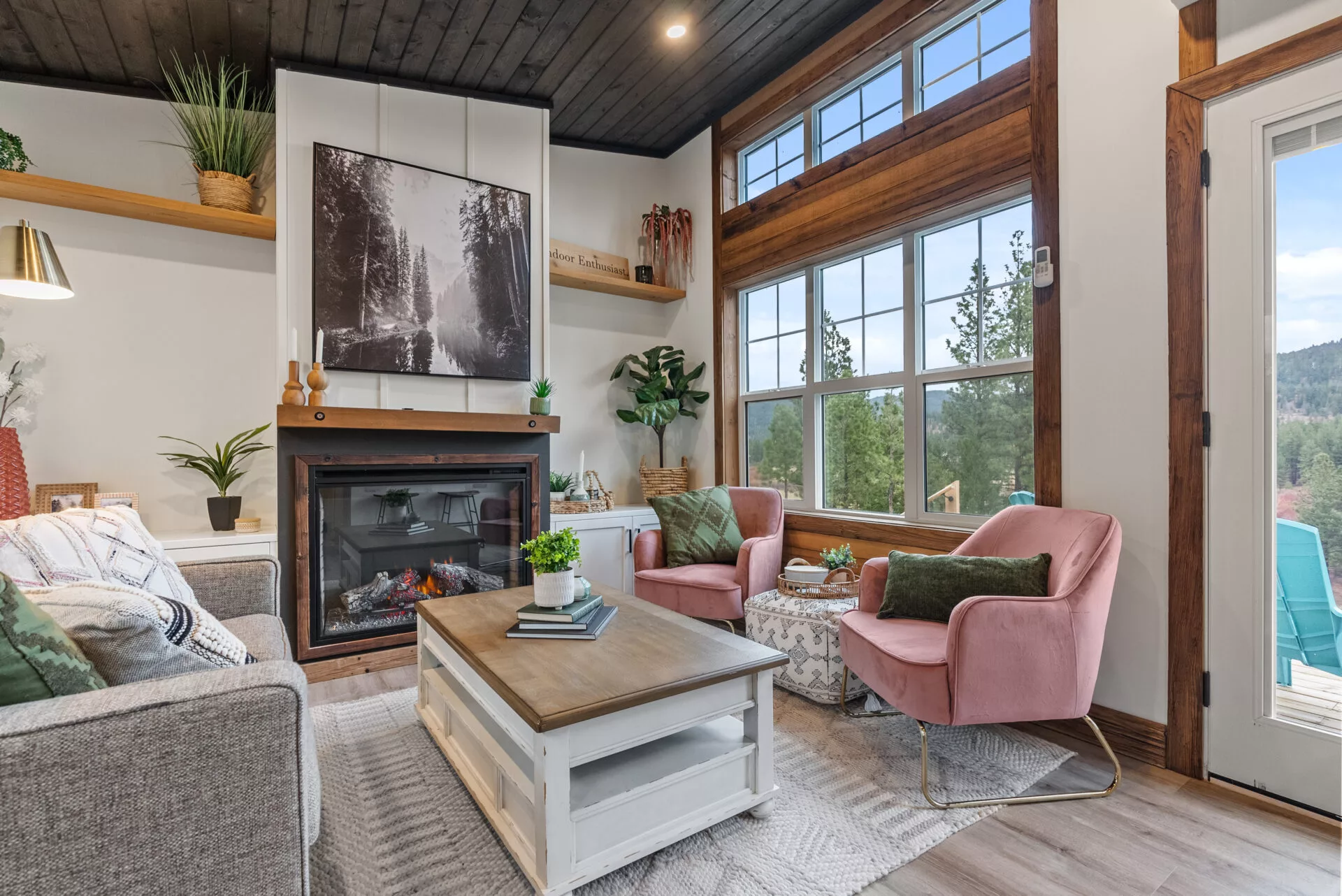 The Silvertip's living room looks light-filled, thanks to its generous glazing