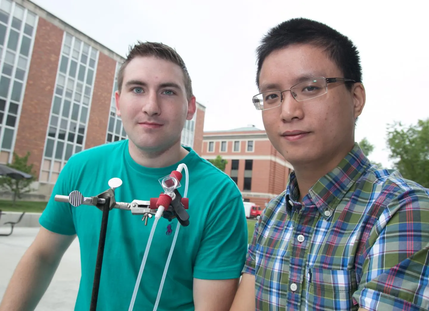The Ohio State University researchers with the prototype device they call the first aqueous solar flow battery