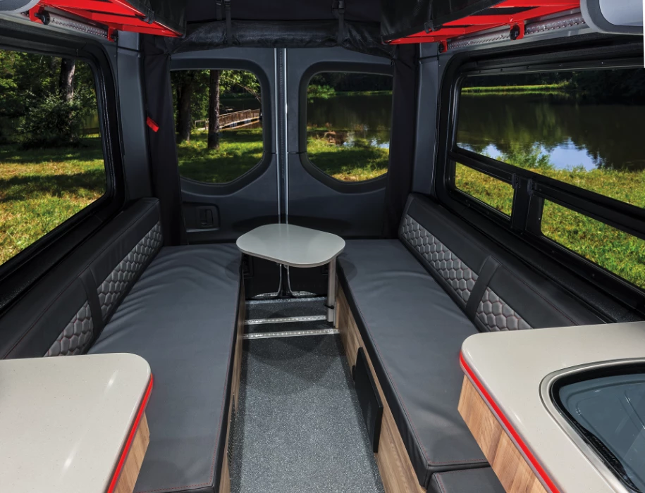 The rear lounge features two benches and a removable swivel table
