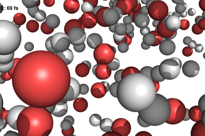 A simulated image of the water molecules after being struck with an intense X-ray pulse, as the hydrogen (white) and oxygen (red) atoms begin to split apart