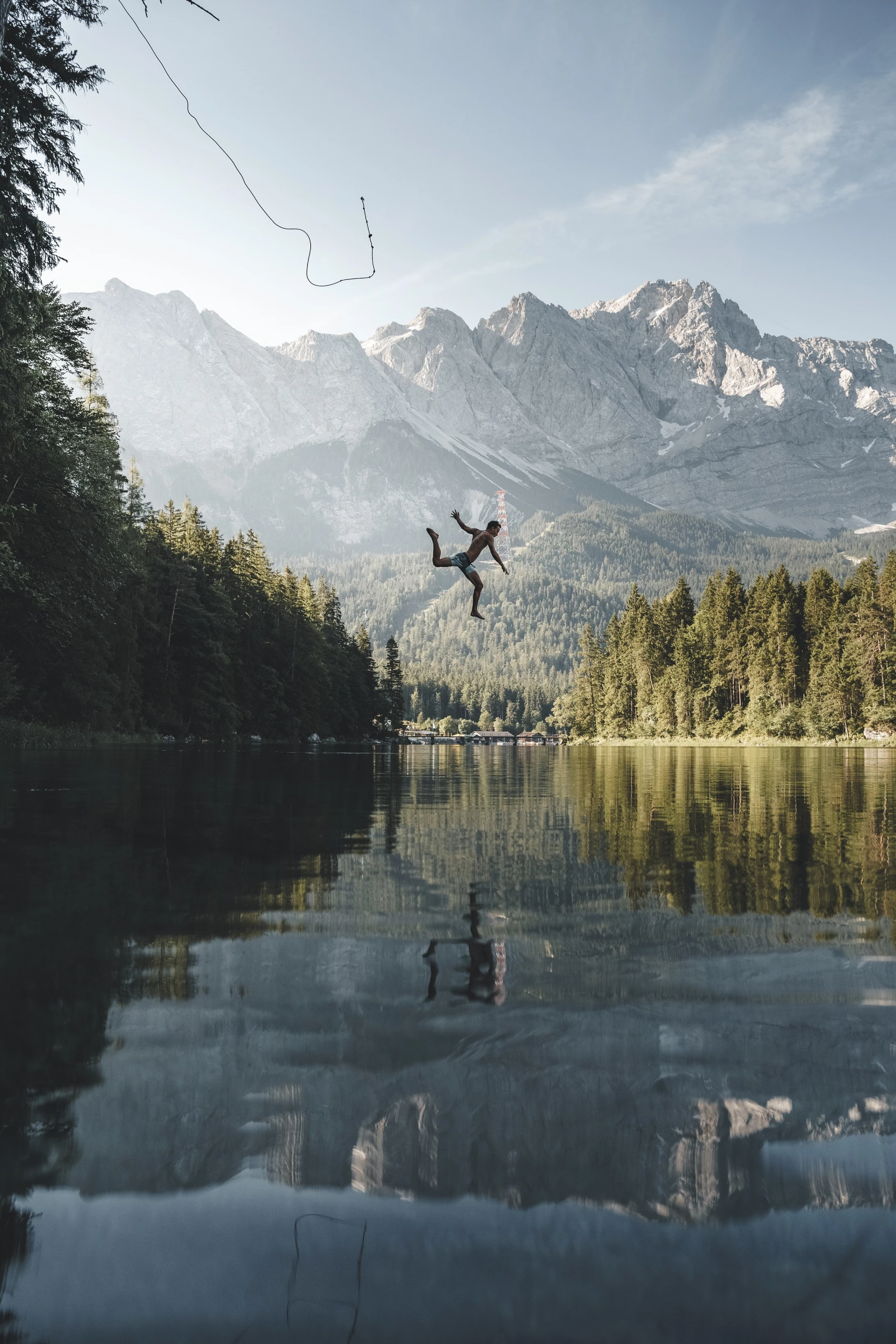 Honorable Mention, People in Nature. A jump into the iconic lake Eibsee in southern Germany on a hot summer day.