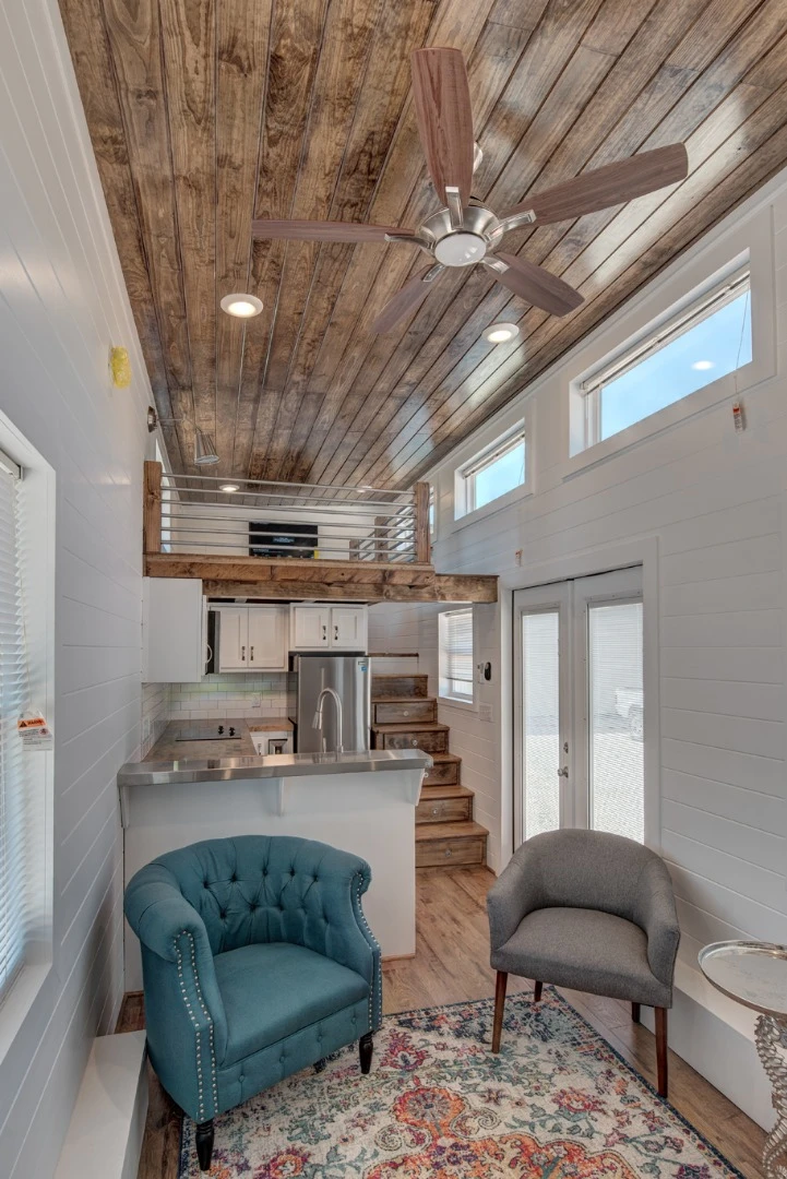 Lofts have become an almost essential component of tiny house living, but few offer the headroom of the recently completed Journey by Alabama Tiny Homes