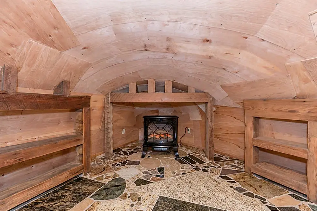 The Cowboy Boot House's second bedroom looks quite low-ceilinged