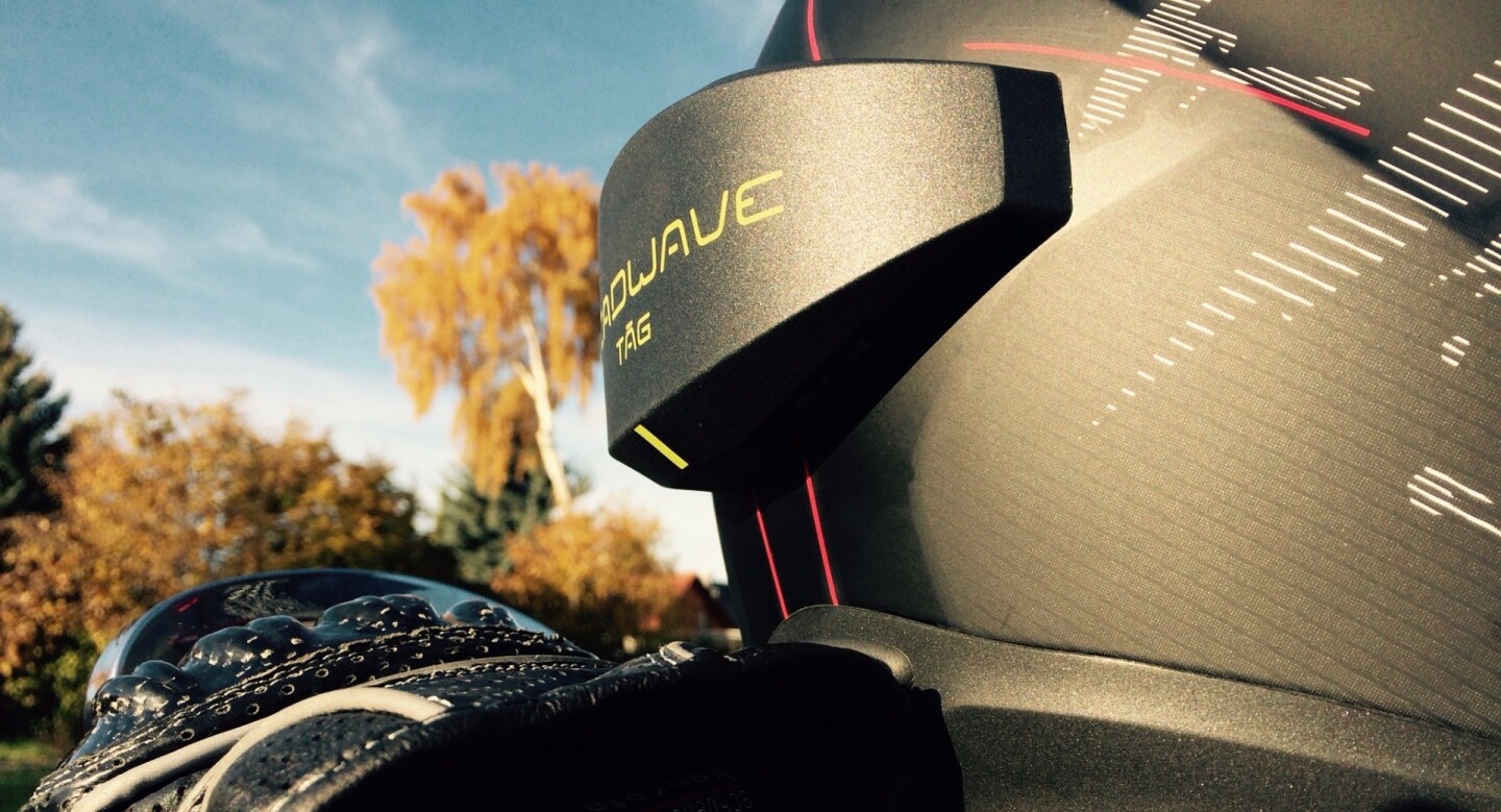 The device is attached to the outside of the helmet using an industrial-strength adhesive and has an adjustable curvature to fit different helmet shapes, sizes and models