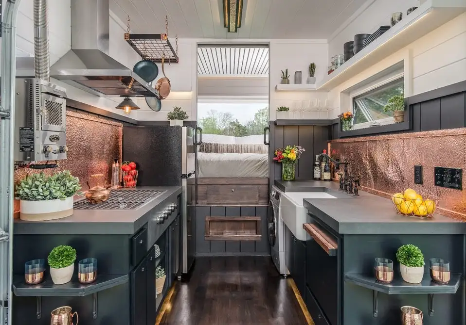 The Escher's kitchen includes a Whirlpool fridge, Wolf cooker and lots of custom storage space