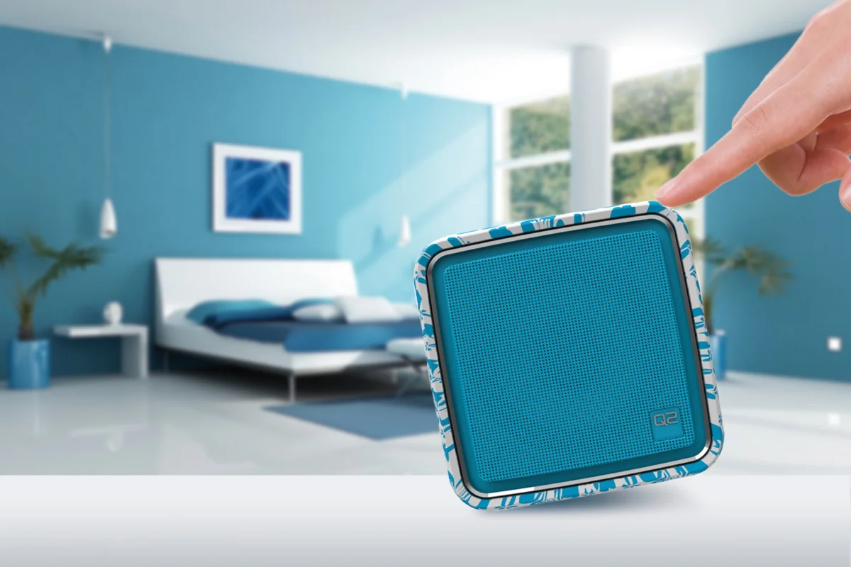 The Q2 Internet Radio has its four pre-allocated stations changed by tipping the device onto its side, its volume adjusted by raising or lowering the front end, and is muted by placing the speaker face down