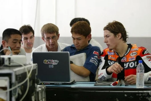 Nicky Hayden and the team working on the set-up of the bike. It wasn't that long ago that a personal computer was never seen in a MotoGP pit. Not so any more.