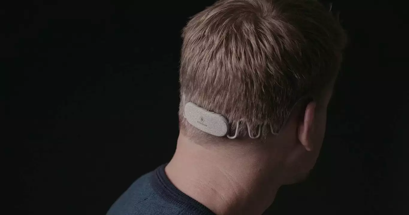 Wrapping around the back of the head, the main control unit houses a large battery as well as the brains of the earbuds