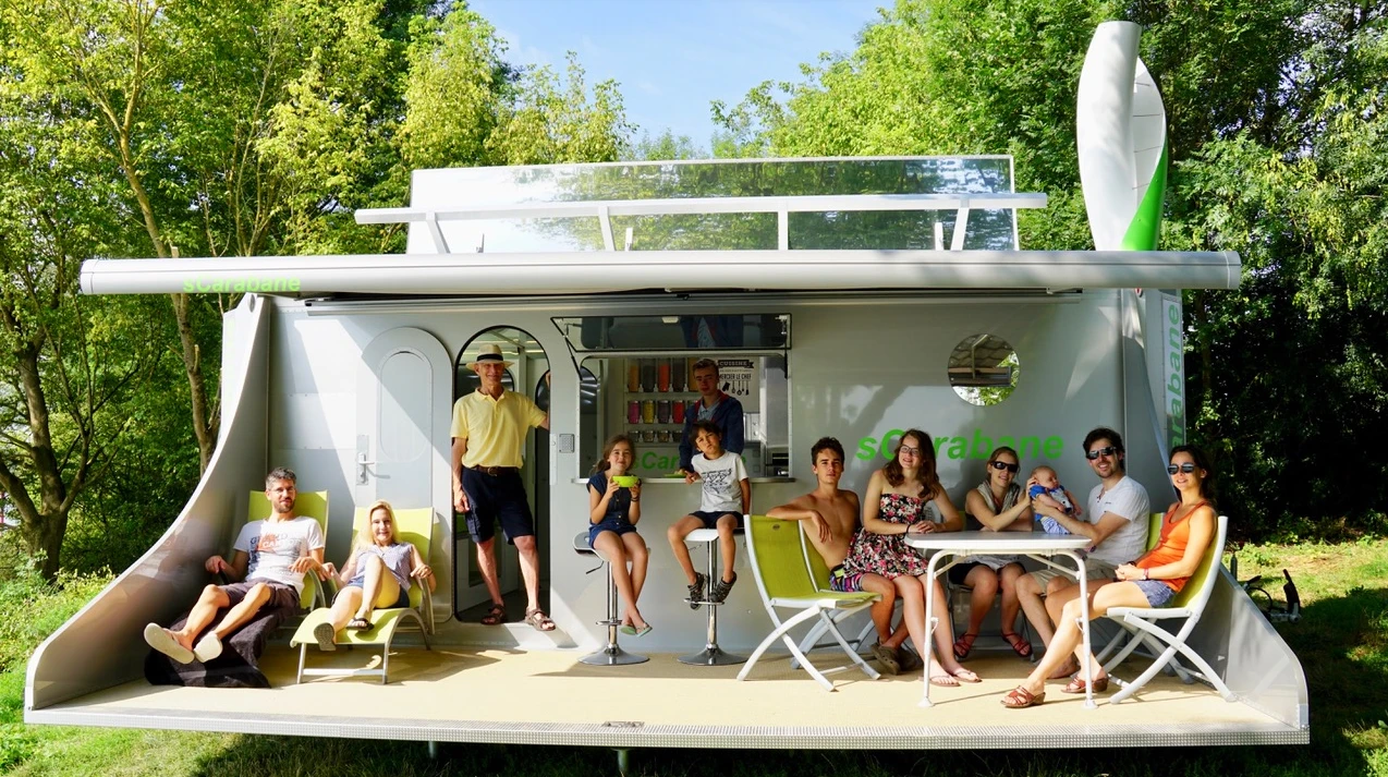 We love the outdoor deck, but we'd imagine a production version would lose it to save weight and complication. With the right furniture, the grass in front of the caravan would make a comfy enough outdoor lounge