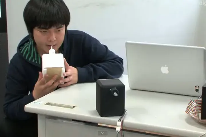 A student at Tokyo's University of Electro-Communications has invented a robotic tongue device for online kissing (Image: DigInfo News)
