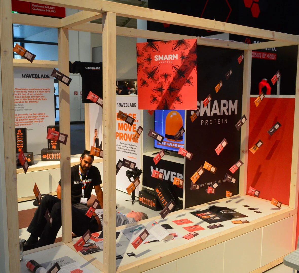 Swarm highlights the insect base of its product with a display of flying protein bars. Like Chapul, Swarm uses cricket-based protein