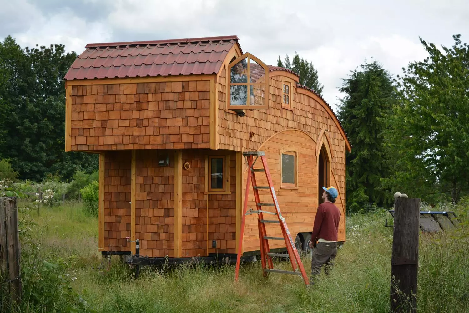 The tiny house features plenty of windows, plus a skylight adds natural light