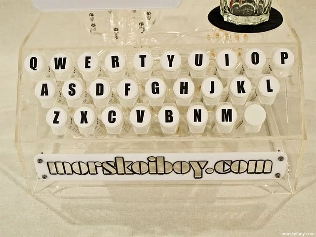 Each of the cocktail typewriter's keys are connected to a syrup- or liqueur-filled syringe