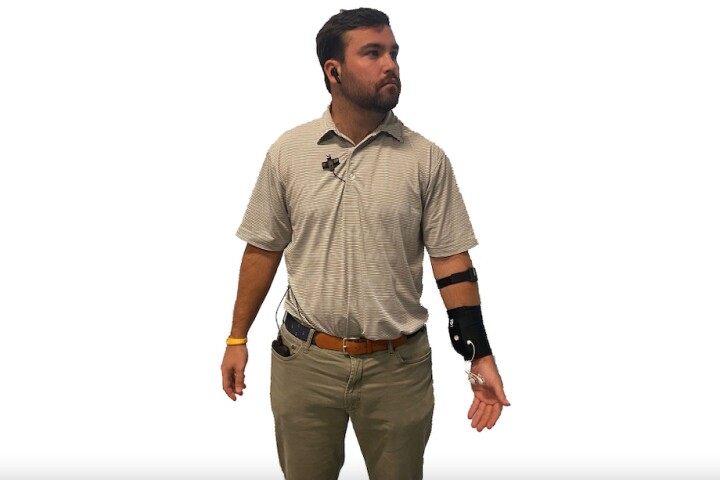Wearable components of the Bio Ware system include a button-shaped camera which is attached to the patient's clothing, a Bluetooth earbud, and an electronics module worn on the wrist