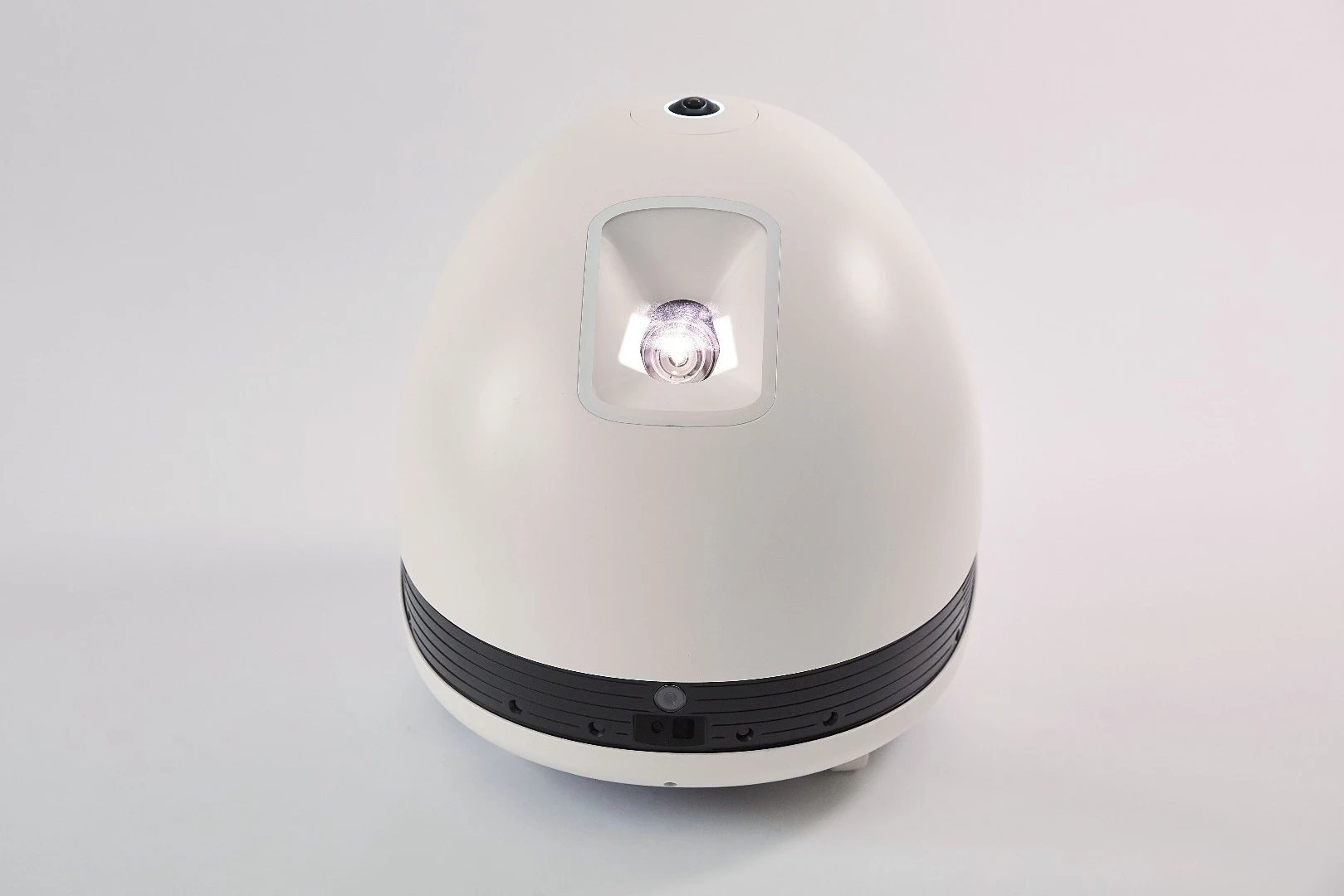The roughly egg-shaped Keecker has an LED projection unit to the front that throws out a 78-inch, 720p image