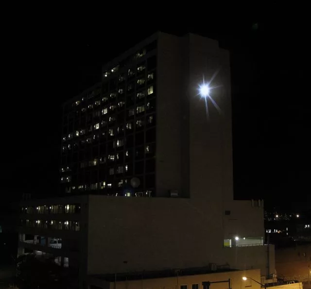 Adam Frank's SUNLIGHT at its peak, on the side of Denver's Minoru Yasui Building
