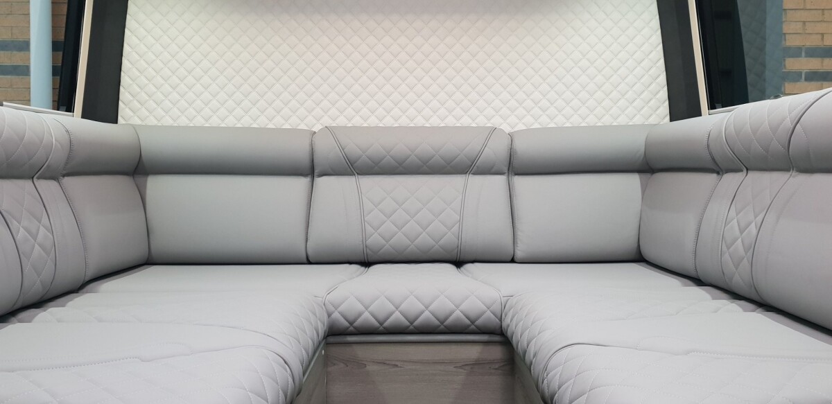 The U-shaped sofa provides plenty of sitting room and converts into a double bed at night