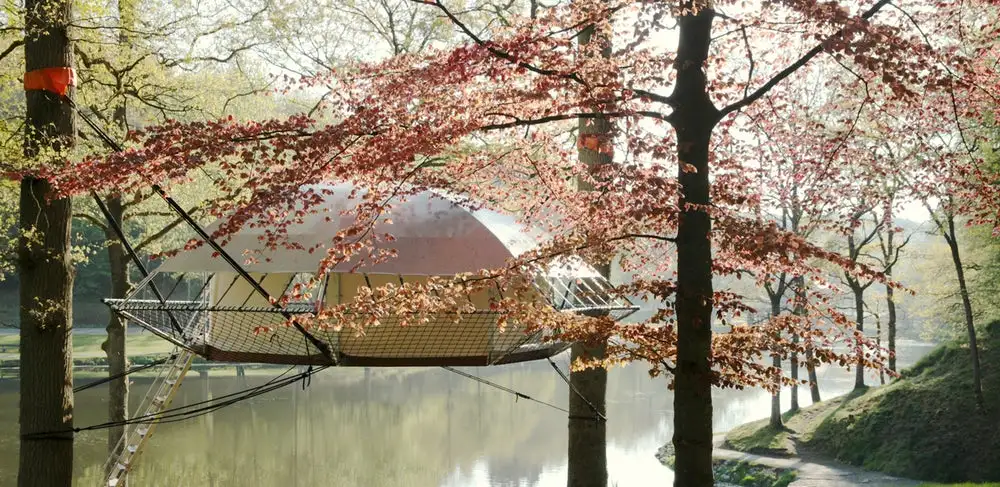The suspension style treehouse called Dom'Up, which draws inspiration from tree camping and traditional treehouse structures